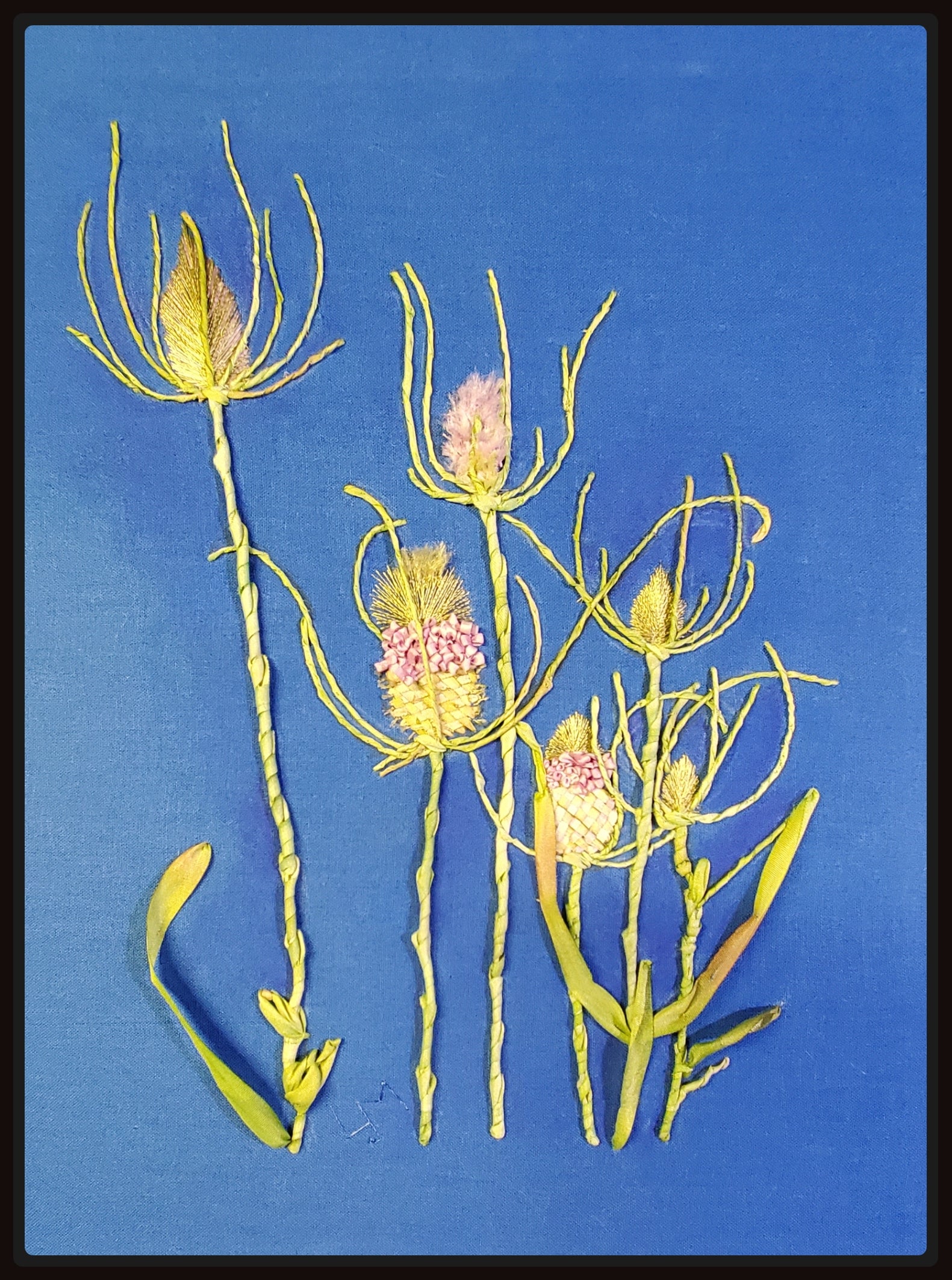 Embroidered floral design on a blue background