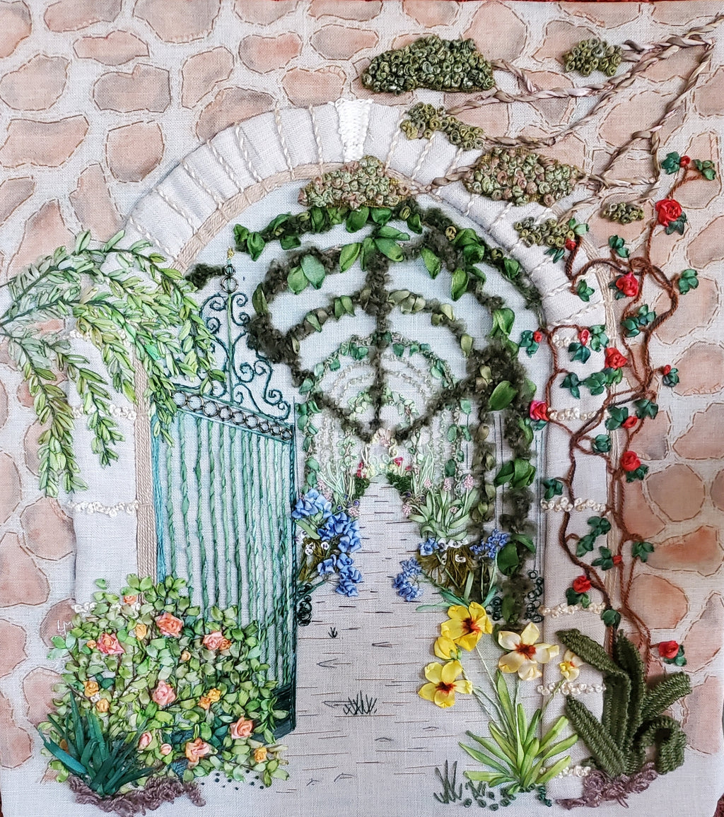 Decorative garden scene with flowers, plants, and a gate on a stone wall background.